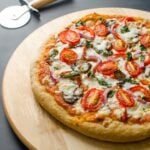 This heathy pizza recipe contains whole wheat pizza crust (low in fat), veggie toppings and homemade pizza sauce.