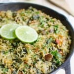 Spinach rice with beans in a cast iron pan.