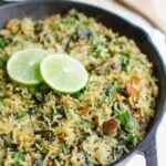 Spinach rice with beans in a cast iron pan.