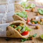 Naan bread vegan wraps filled with toasted chickpeas. This wrap is healthy and filling. No naans... then replace with pita or soft tacos.