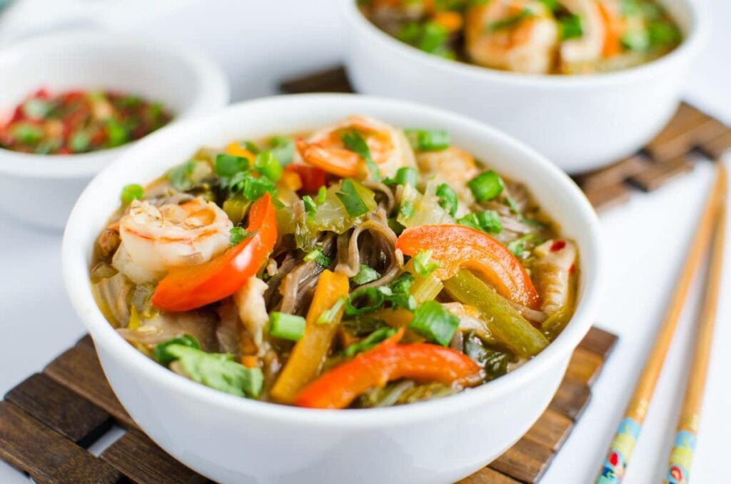 Asian soba noodle soup loaded with fresh vegetables. Rich in fibers and proteins. Healthy option for busy weeknights. 