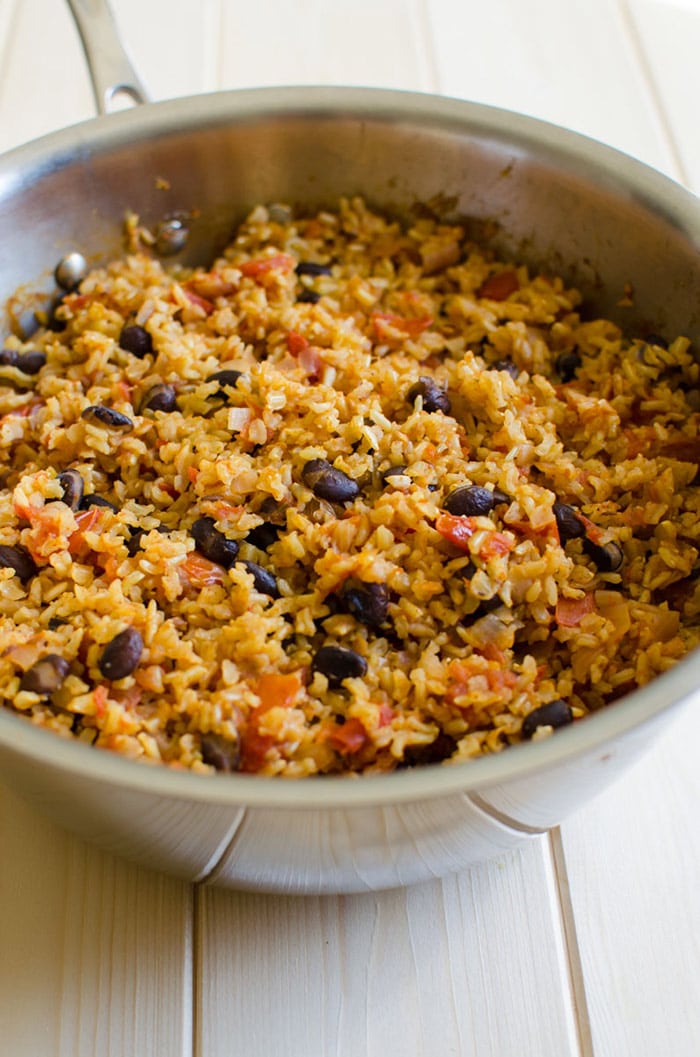 One pot Mexican brown rice in a stainless steel pot after cooking. 