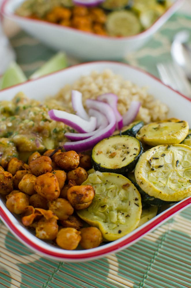 Healthy quinoa bowl that is prepared using roasted veggies like squash and zucchini.