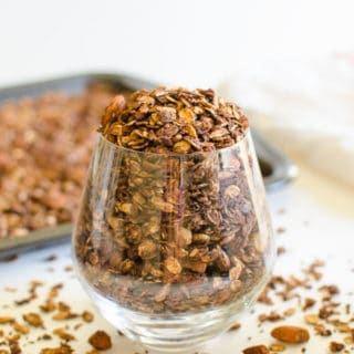 This chocolate covered homemade granola is prepared using rolled oats, nuts, seeds, and of course chocolate etc. It is almost like a mixture of trail mix + rolled oats.