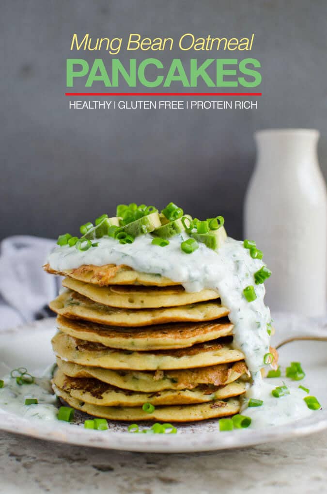 Pinterest pin of mung bean oatmeal pancakes. Stack of these pancakes topped with yogurt sauce, slices of avocado and chopped scallions.