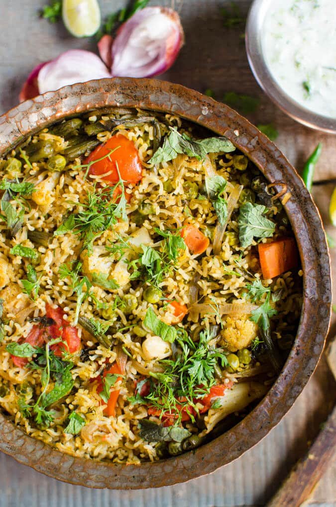 One pot delicious and easy veg biryani prepared using variety of fresh veggies. Healthy and nutritious | watchwhatueat.com