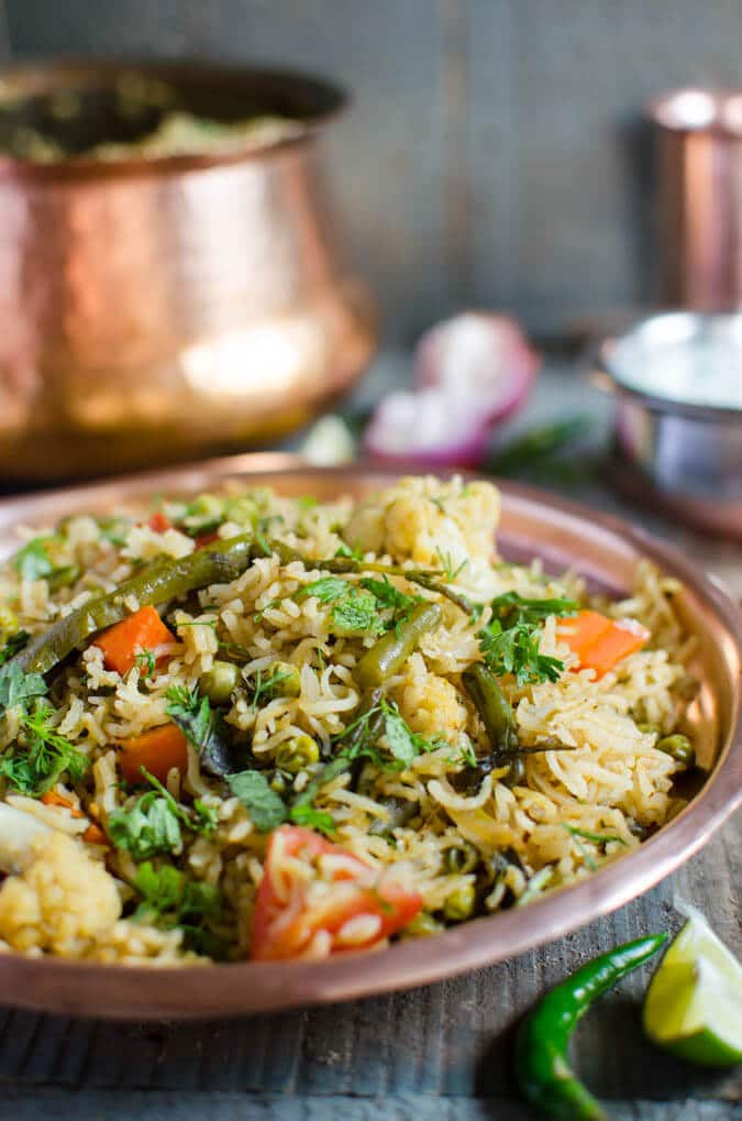 Vegetable biryani in a metal dinner plate. 