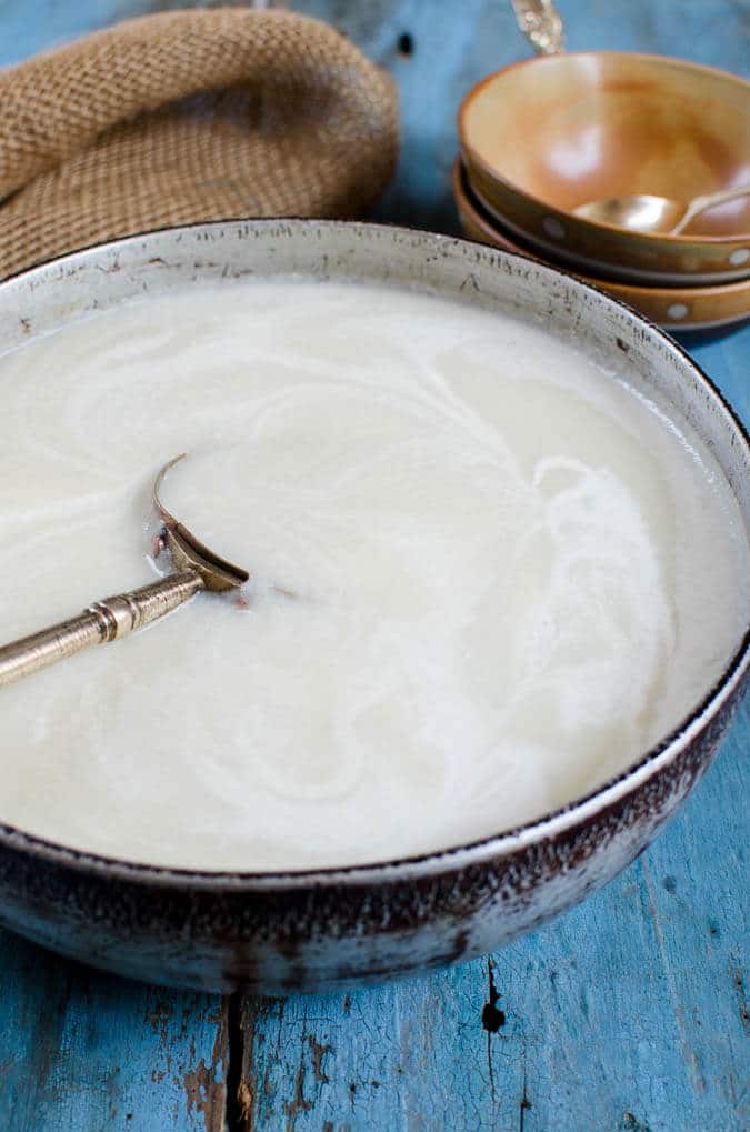 No cream and no cheese yet creamy cauliflower soup. Also, it is vegan and gluten free. | watchwhatueat.com