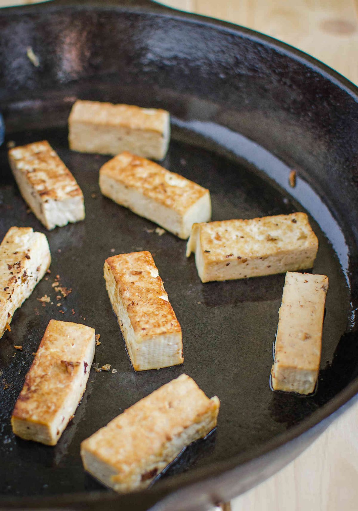 image of roasted tofu pieces in a cast iron pan.