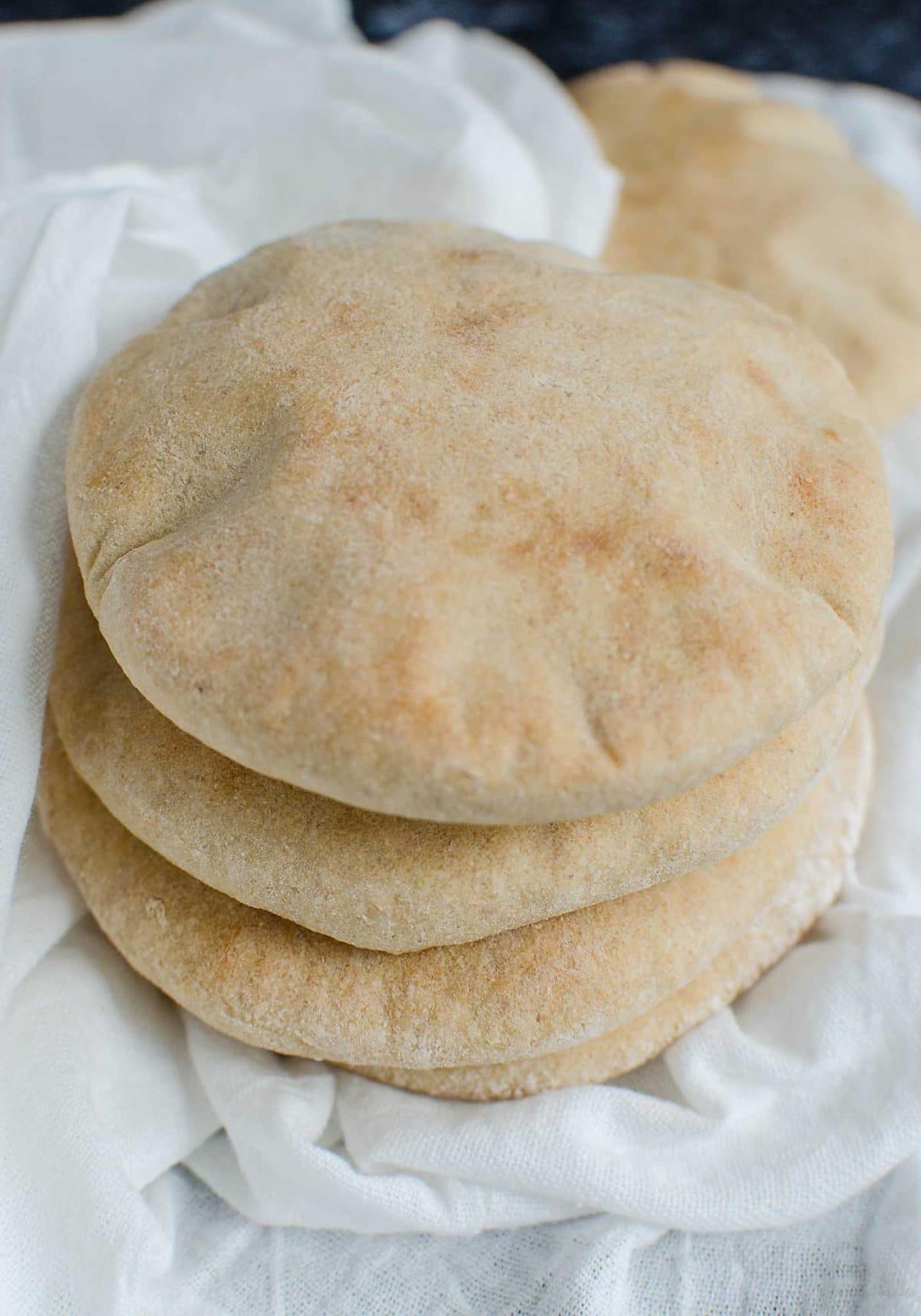 stack of fresh whole wheat pita bread is ready serve. 