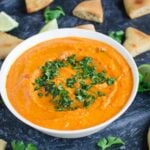 Easy homemade hummus prepared using roasted red peppers. @watchwhatueat