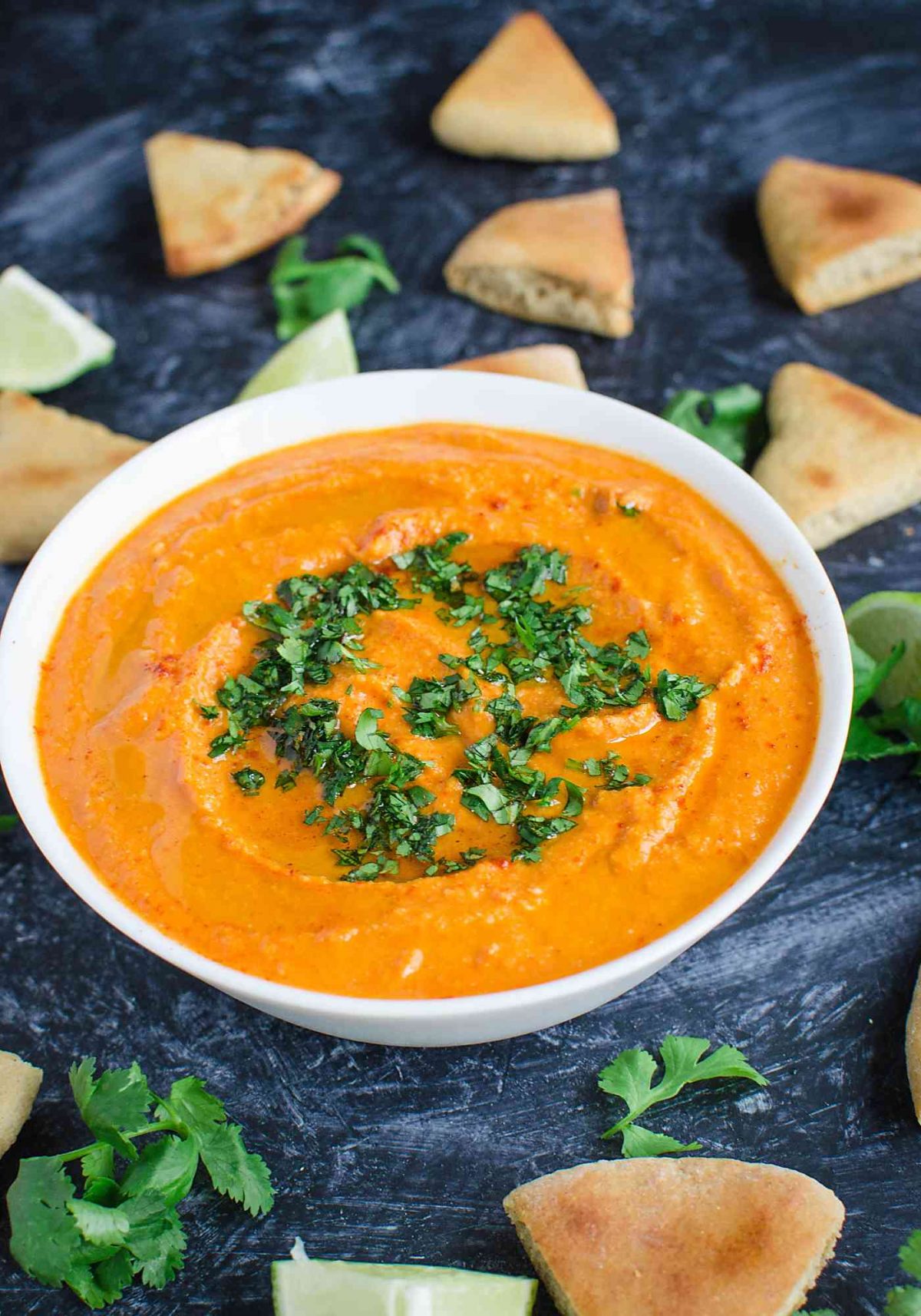 Easy homemade hummus prepared using roasted red peppers. @watchwhatueat