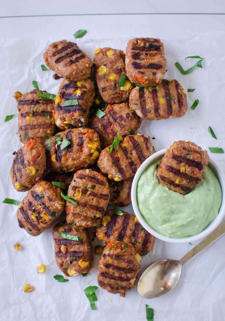 Mini turkey meatloaves served with a dipping sauce on the side.