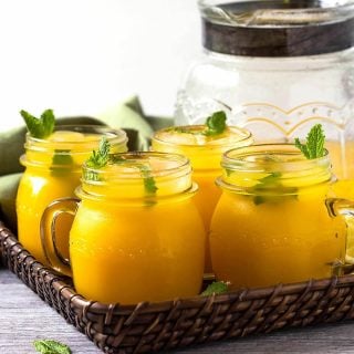 Refreshing mango lemonade to enjoy hot summer days. Prepared using fresh zesty lemon juice, honey, & mango pulp. Healthy, delicious & naturally sweetened fresh lemonade