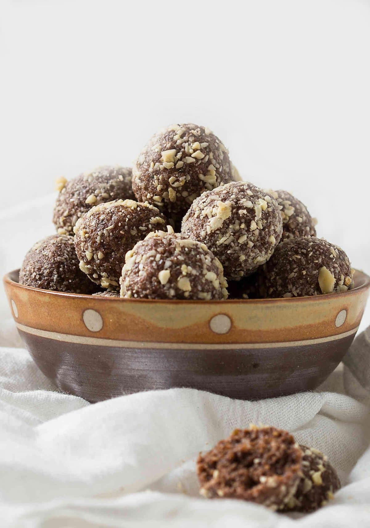 Coconut and almond butter based no bake energy balls. Nutritious and naturally sweetened.