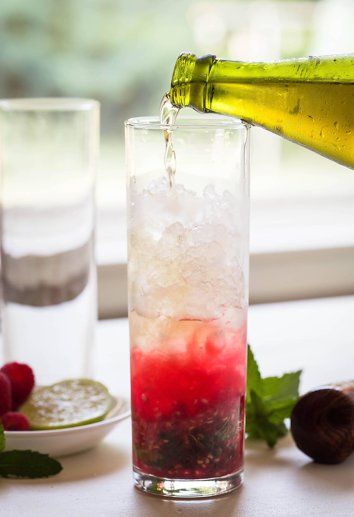 Turn fresh raspberries into this non-alcoholic Raspberry Mojito. It's a perfect drink to enjoy summer