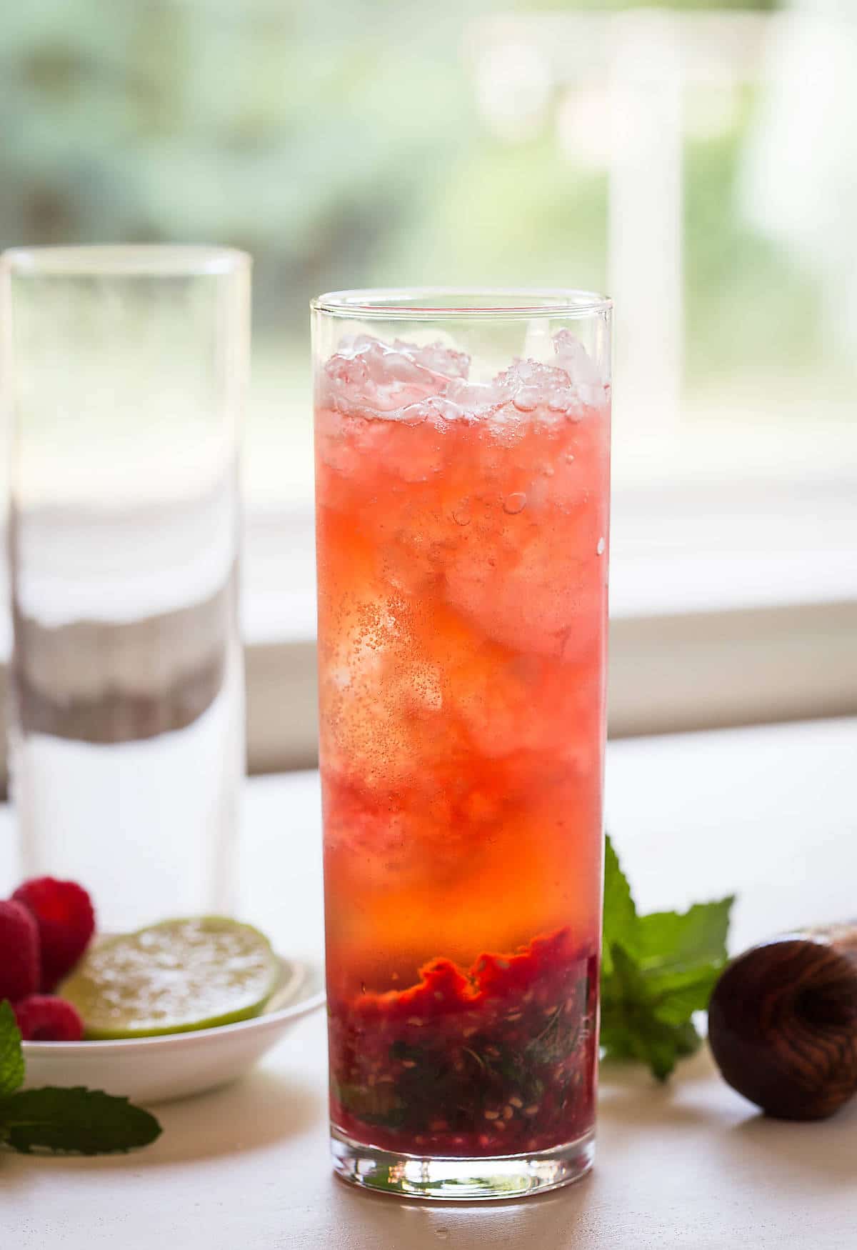 Turn fresh raspberries into this non-alcoholic Raspberry Mojito. It's a perfect drink to enjoy summer