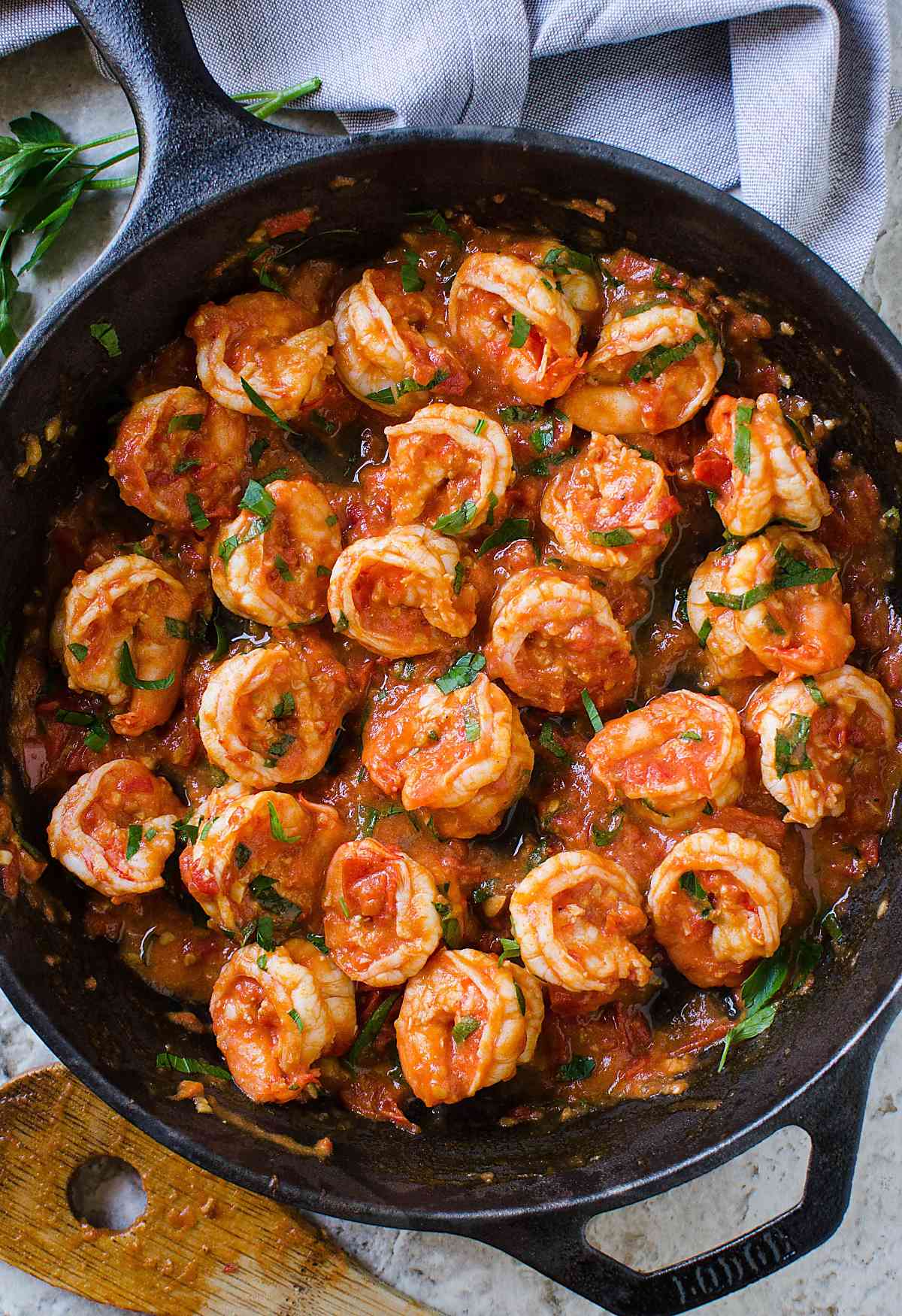 Garlic tomato shrimp prepared in cast iron skillet. 