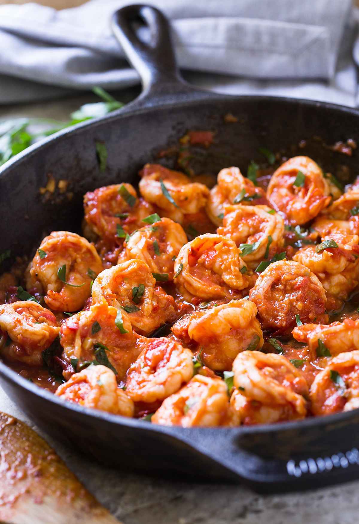 Garlic tomato shrimp prepared in cast iron skillet. 