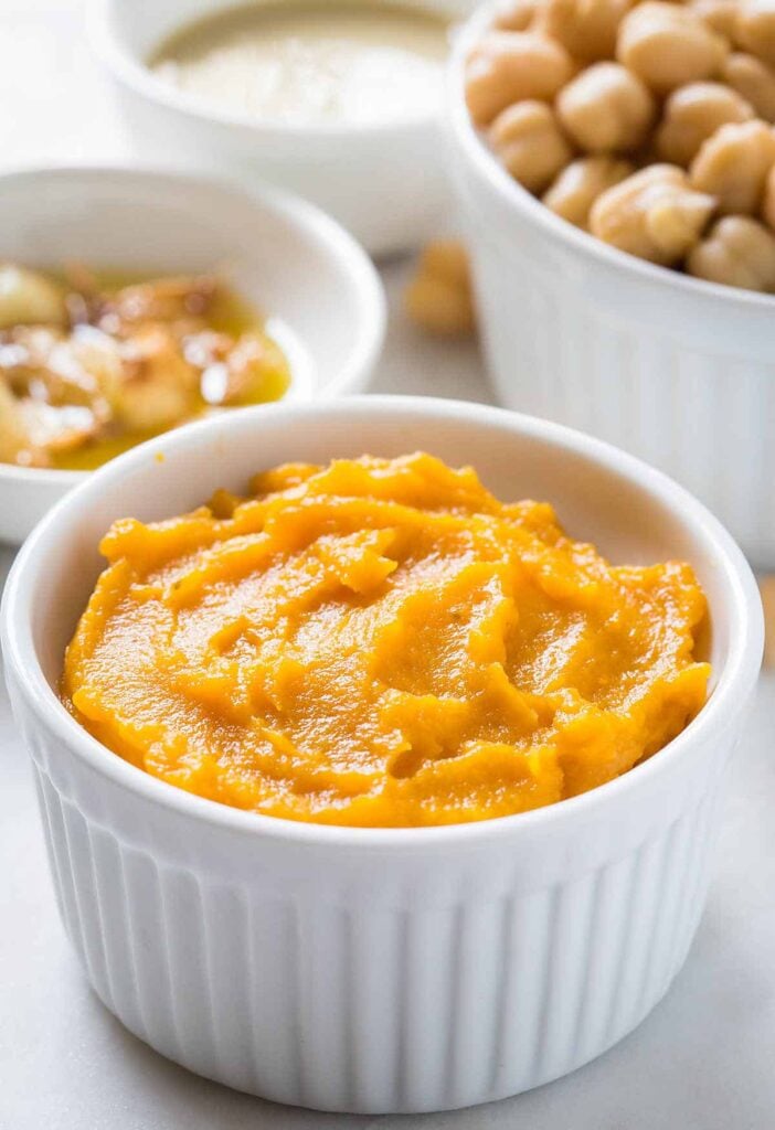 Pumpkin puree in a small white bowl.