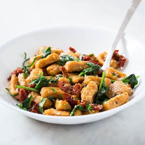 Sweet potato gnocchi with spinach and sun-dried tomatoes