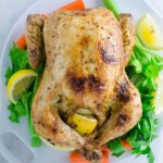 Super juicy garlic and herb roasted whole chicken you can make for your weekend family dinner or holiday party night. Super easy with quick preparation and tons of flavors.
