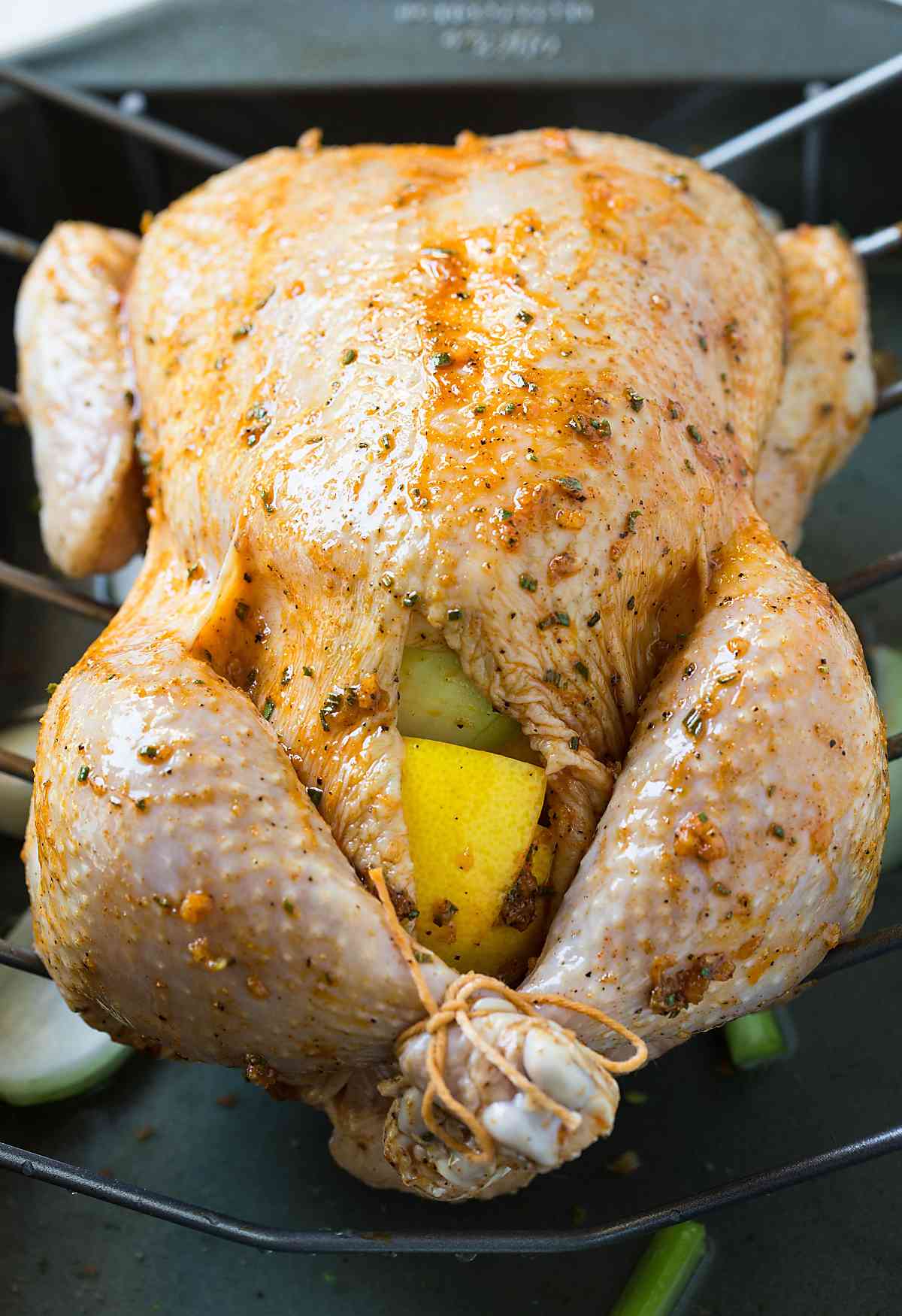Whole chicken rubbed with herb marinade and stuffed with fresh onion and lemon.