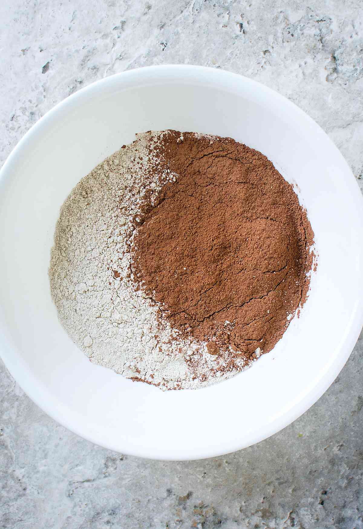 Flour and cocoa powder in a mixing bowl.