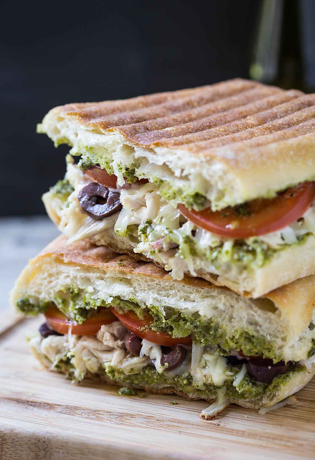 Shredded leftover chicken sandwich on a flat surface.