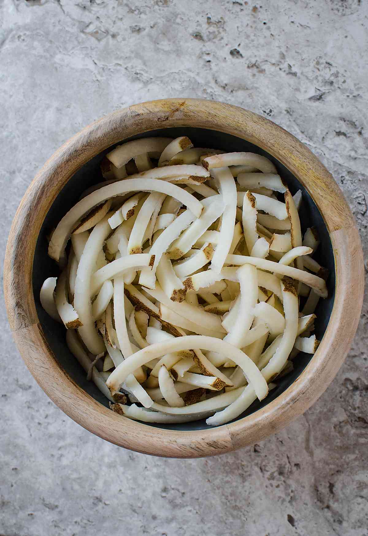 Russet potatoes cut into fries shape for making Air Fryer French Fries.