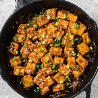 Extremely flavorful, Asian chili garlic tofu stir-fry in just 30 minutes! A perfect meatless dish you can prepare for lunch or dinner. #tofu #vegan #meatless #asian