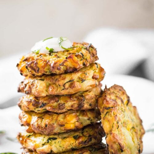 Make these healthy Zucchini Corn Fritters from fresh zucchini and corn with this simple recipe. Fry them in an Air Fryer with very little oil for healthy snacks or appetizers. #zuchhini #fritters #vegan #glutenfree #airfryer
