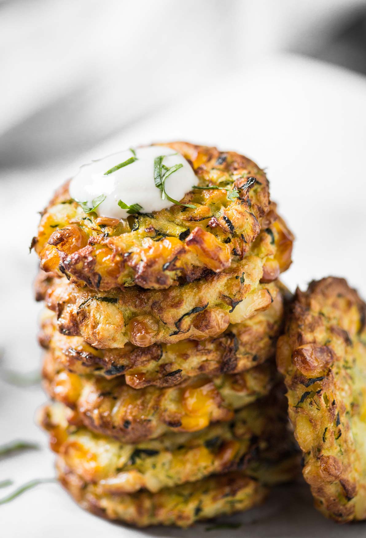 A stack of air fried zucchini fritters ready to serve.