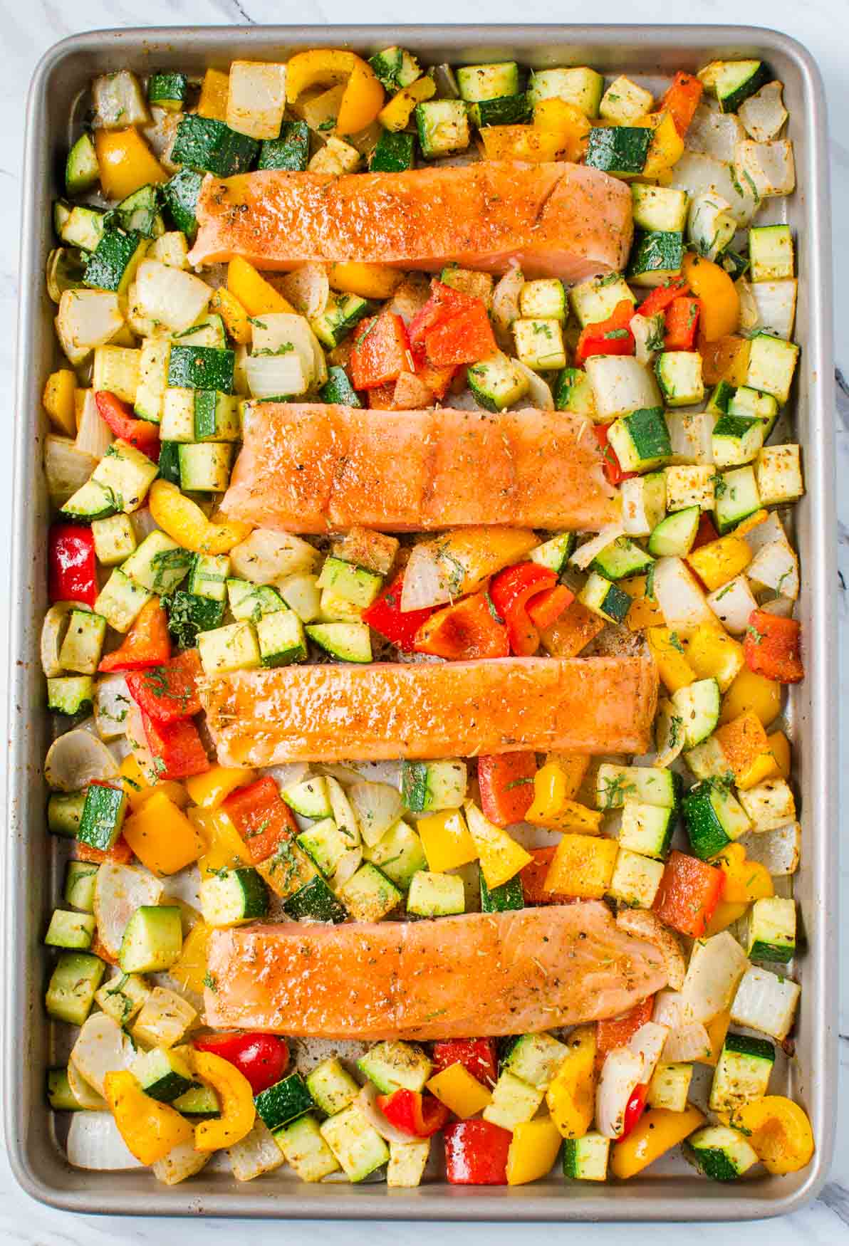 Salmon and vegetables baked together in one pan for an easy, healthy and quick dinner.
