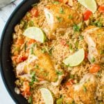 Healthy Mexican Chicken Rice made in one pot with tons of flavors and deliciousness. A perfect easy dish for busy weeknight dinner. Full of colors with nutritious veggies you will want to make this Mexican rice again and again. #onepot #Mexican #chicken #rice #healthyrecipes #watchwhatueat