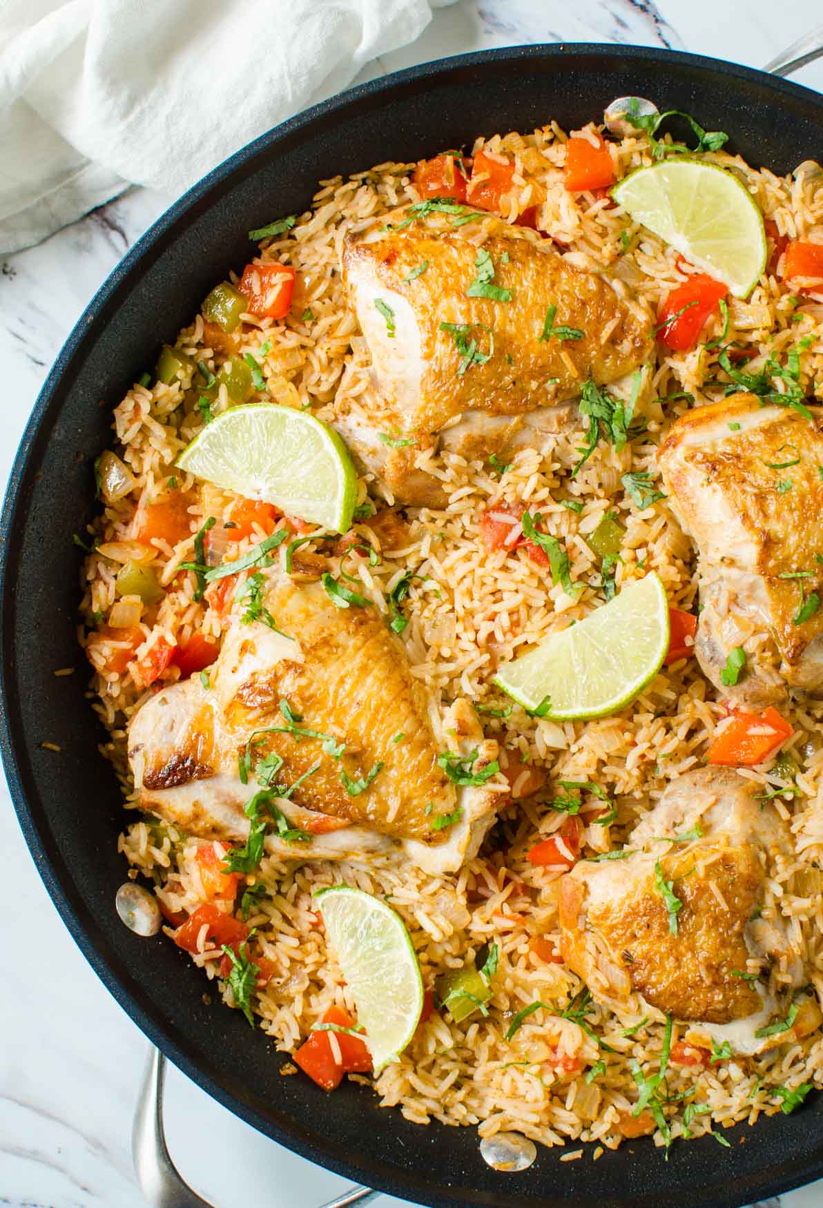 Healthy Mexican Chicken Rice made in one pot with tons of flavors and deliciousness. A perfect easy dish for busy weeknight dinner. Full of colors with nutritious veggies you will want to make this Mexican rice again and again. #onepot #Mexican #chicken #rice #healthyrecipes #watchwhatueat