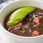 Looking for an Instant Pot recipe? Then try this easy and healthy black bean soup recipe. You will love this no-soak method to prepare the soup from raw black beans. Full of flavors, vegan and gluten-free soup for lunch or dinner.#instantpot #pressurecooker #blackbeans #soup #vegan #glutenfree