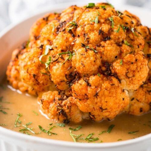 Healthy Instant Pot Cauliflower - cook whole cauliflower head in the pressure cooker and serve with delicious creamy gravy to make it more flavorful. Perfect vegetarian and vegan recipe for the holiday dinner or weeknight healthy meal. | #watchwhatueat #veganthanksgiving #vegan #cauliflower