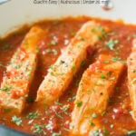 Salmon in Tomato Sauce - cook salmon in fresh garlic and tomato sauce. Serve on the side of pasta, grits or rice for complete healthy dinner or lunch. Quick and easy weeknight meal. #watchwhatueat #salmon #seafood #tomatosauce #healthyrecipes