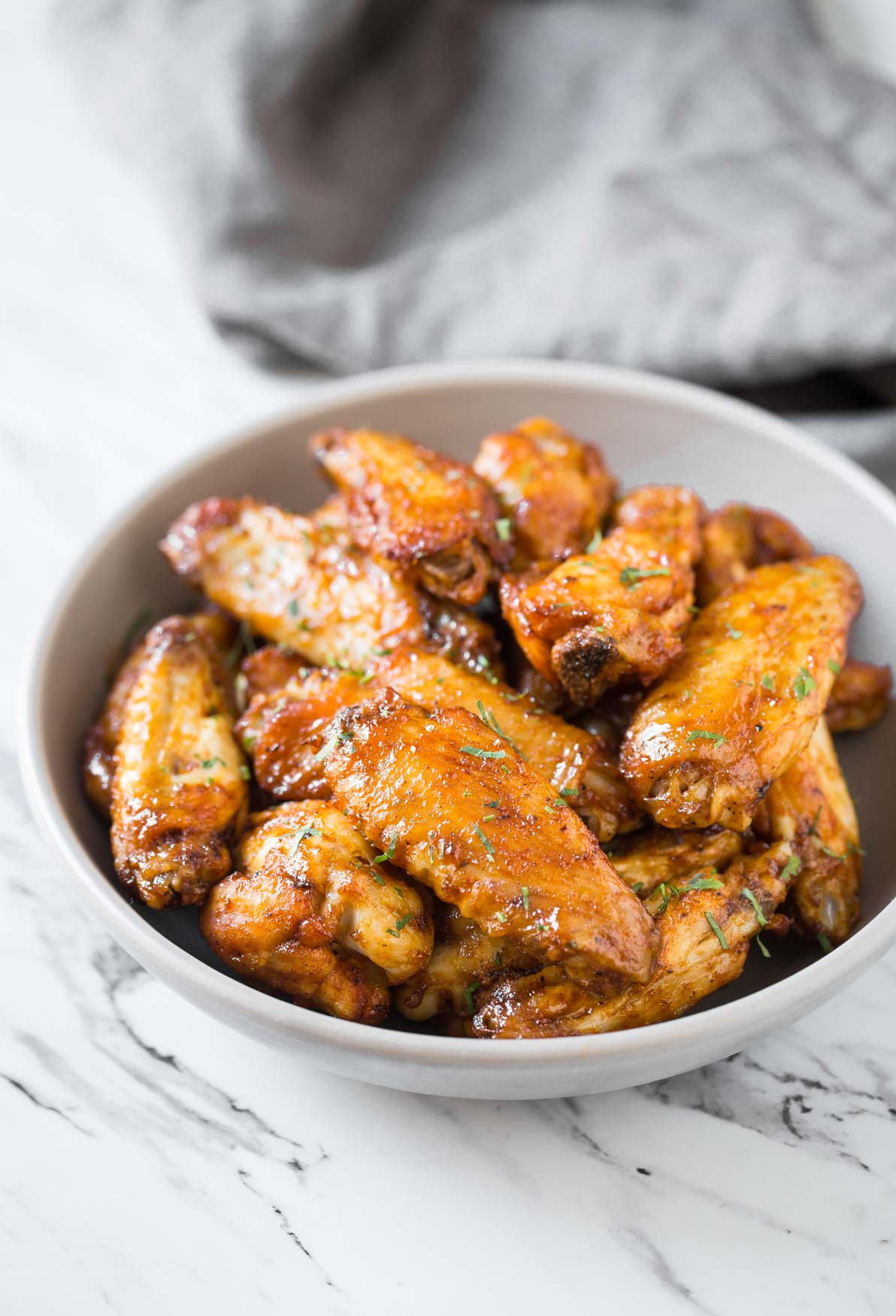 These healthy Air Fryer BBQ Chicken Wings are juicy & tender with amazing smokey flavors from the bbq sauce. Under 30 min, a quick & easy party appetizer or snack recipe.