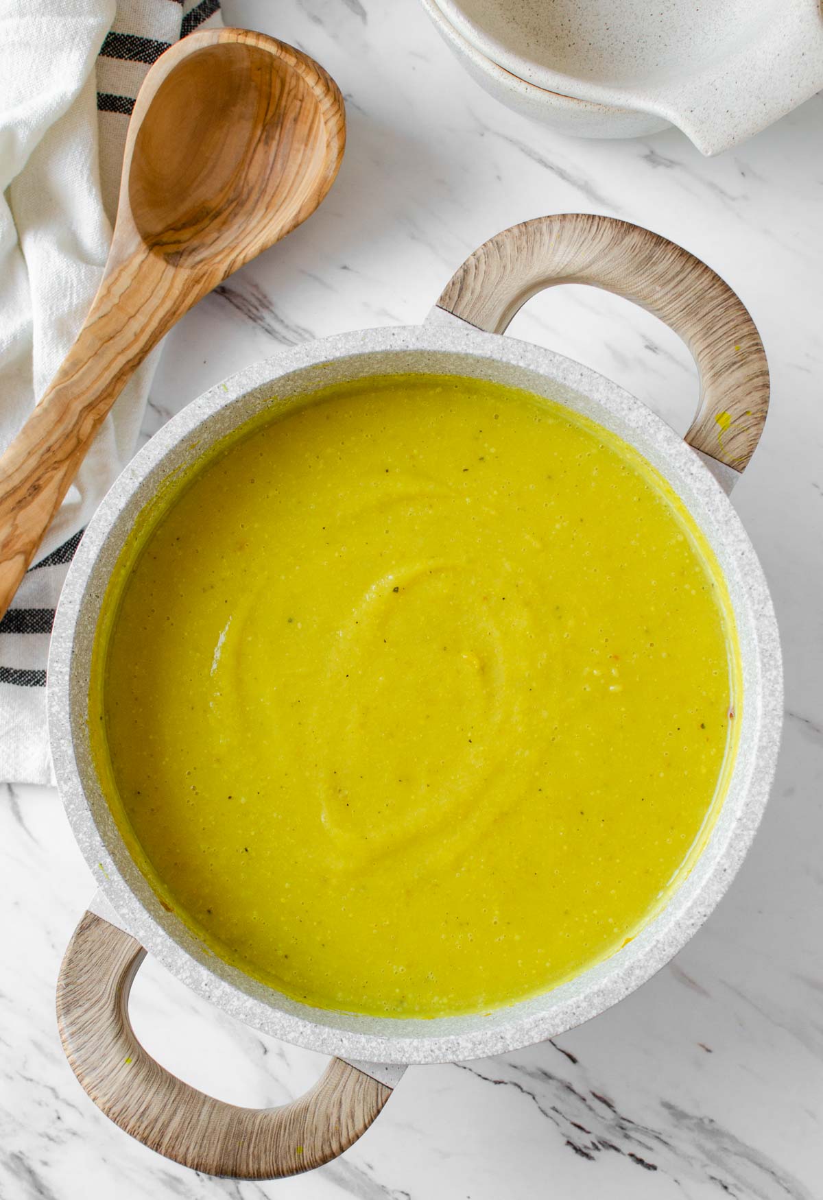 Roast fresh cauliflower florets in the oven and turn them into this amazing roasted turmeric cauliflower soup. Perfect cold-night easy golden healthy soup to get the warmth. 