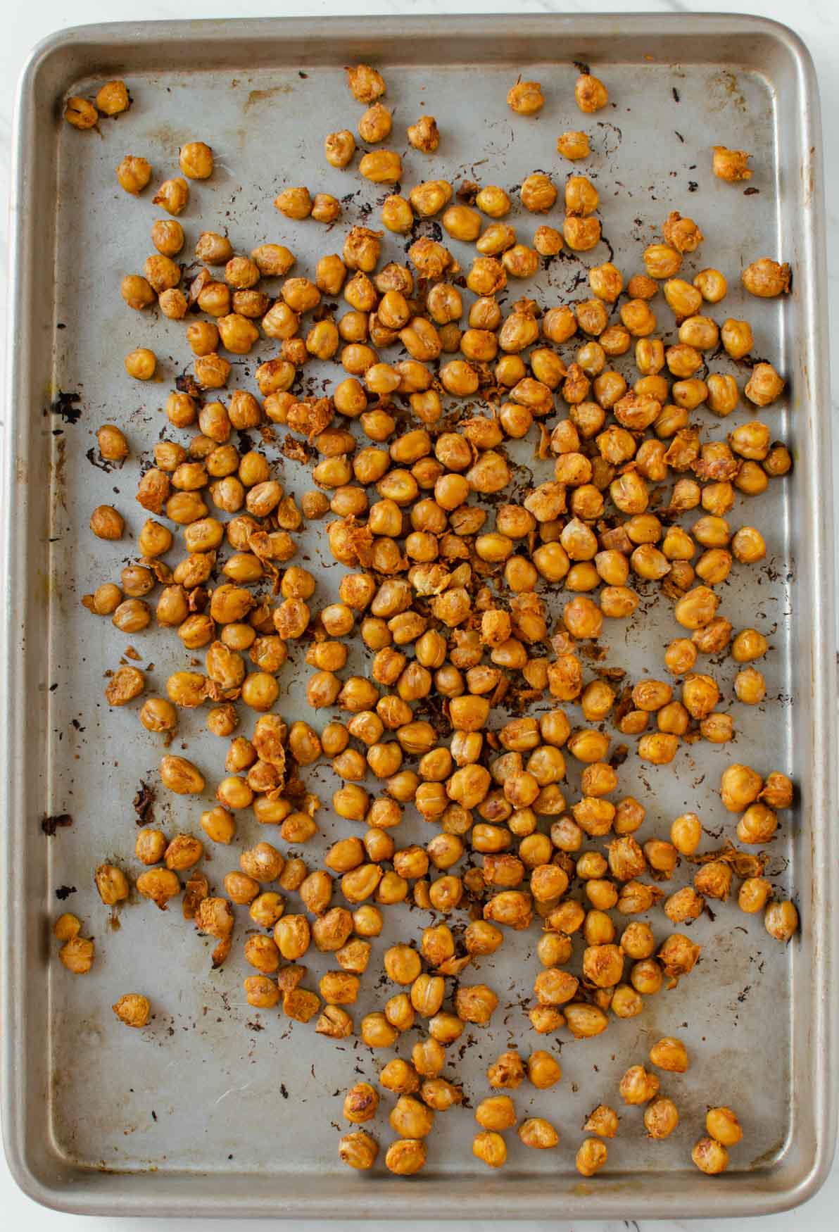 Chickpeas marinated with authentic Indian spices and then toasted in the oven for making Chickpea Tikka Masala.
