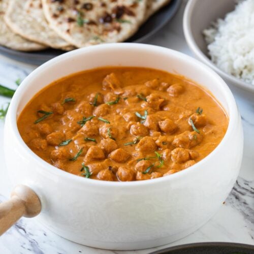 Toasted chickpeas dunked in creamy tomato authentic tikka sauce to make this easy restaurant-style healthy chickpea tikka masala.