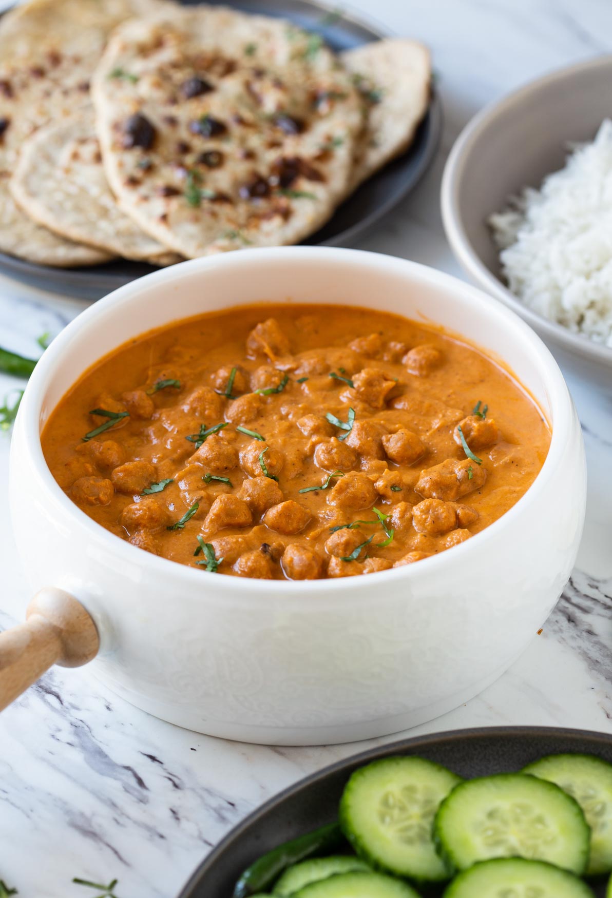 Toasted chickpeas dunked in creamy tomato authentic tikka sauce to make this easy restaurant-style healthy chickpea tikka masala.