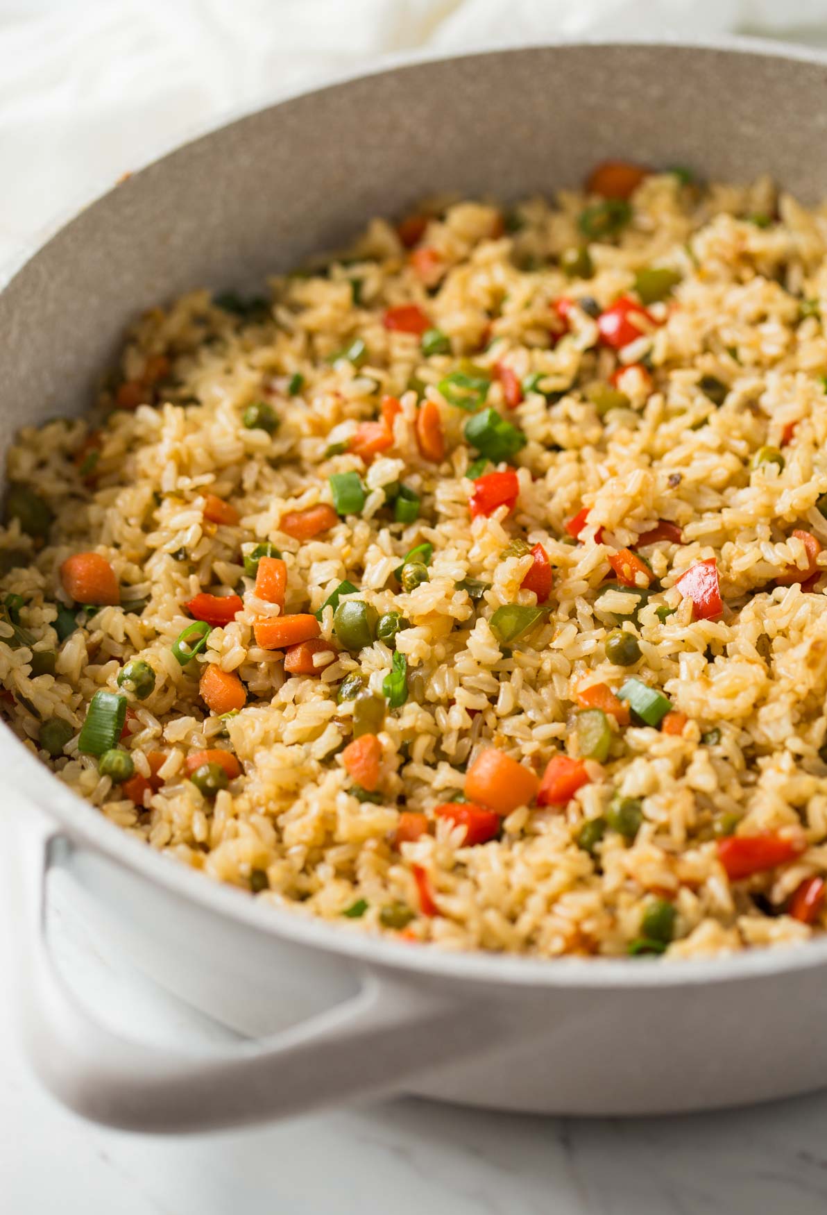 Healthy vegetable fried rice in a large skillet.