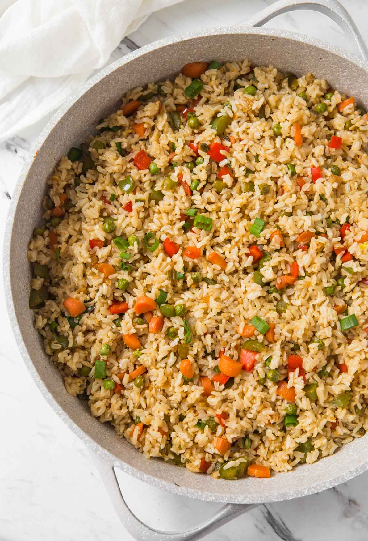 Vegetable fried rice in a large skillet.