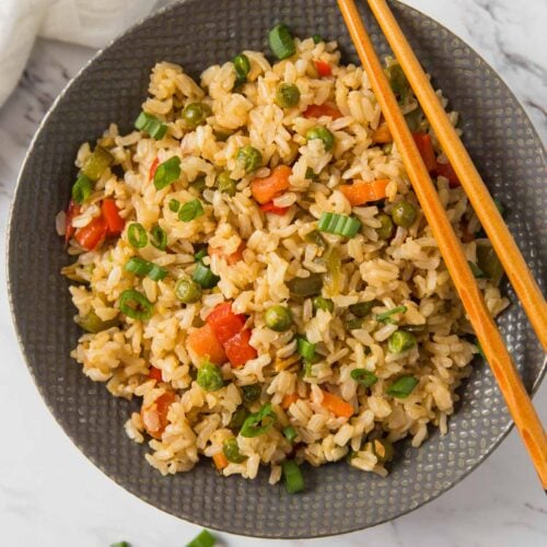 Learn how to make healthy fried brown rice with fresh vegetables. A simple, delicious and wholesome vegetable fried rice recipe that is better than takeout