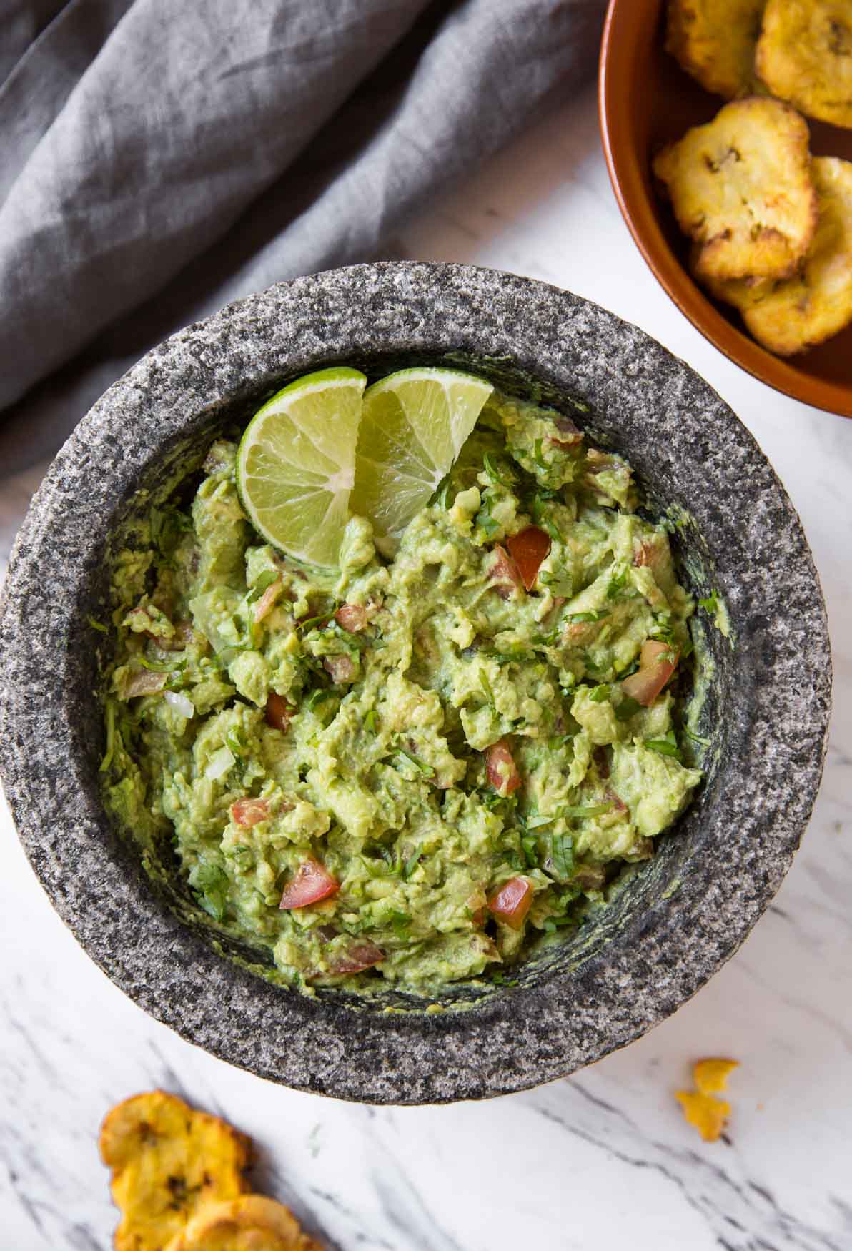 Simple Healthy Guacamole Recipe -- Chunky avocado pulp mixed with fresh chopped tomatoes and onion. Lime juice, fresh cilantro, and seasonings make it even more flavourful.