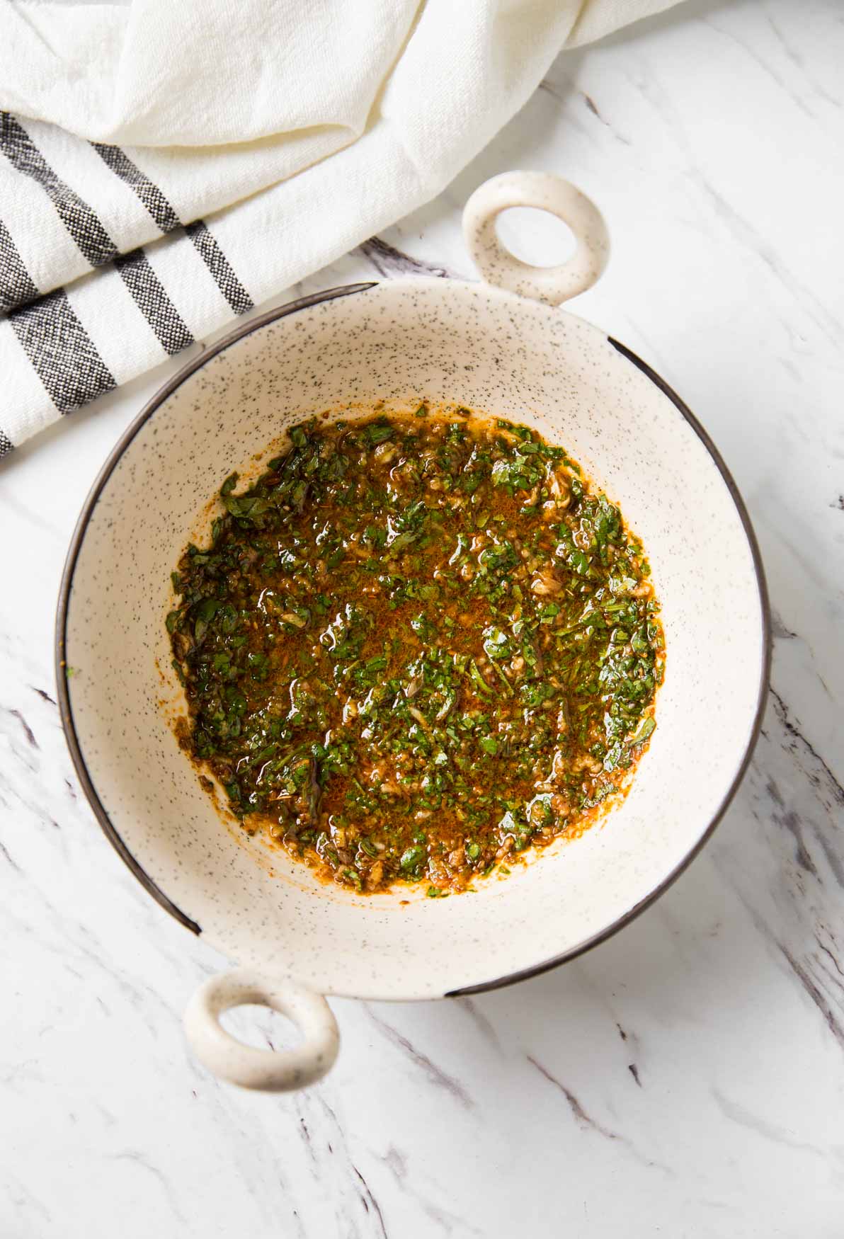 Garlic-cilantro lime marinade prepared in a small mixing bowl.