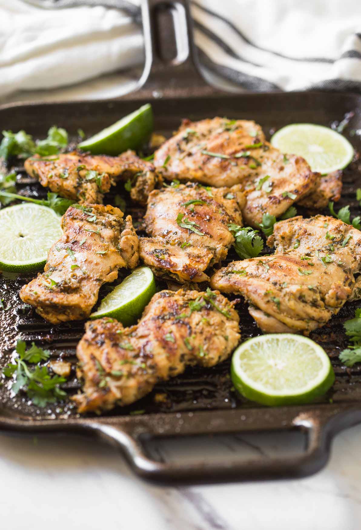 Prepare these cilantro lime grilled chicken thighs with delicious and healthy marinade. A quick and easy prep-ahead recipe perfect for a grilling party. Or just cook marinated chicken on the grill or frying pan for the weeknight dinner. | #watchwhatueat #grilledchicken #cilantrolime #grilling #chickenthighs